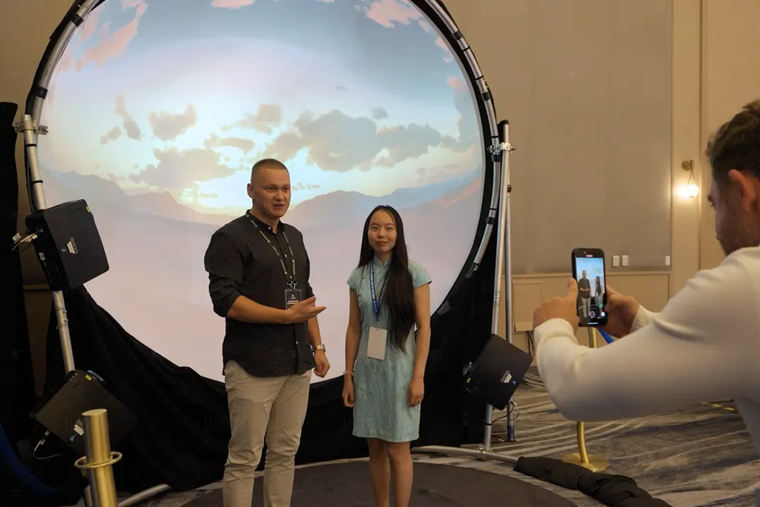 tradeshow visitors interacting with projection dome