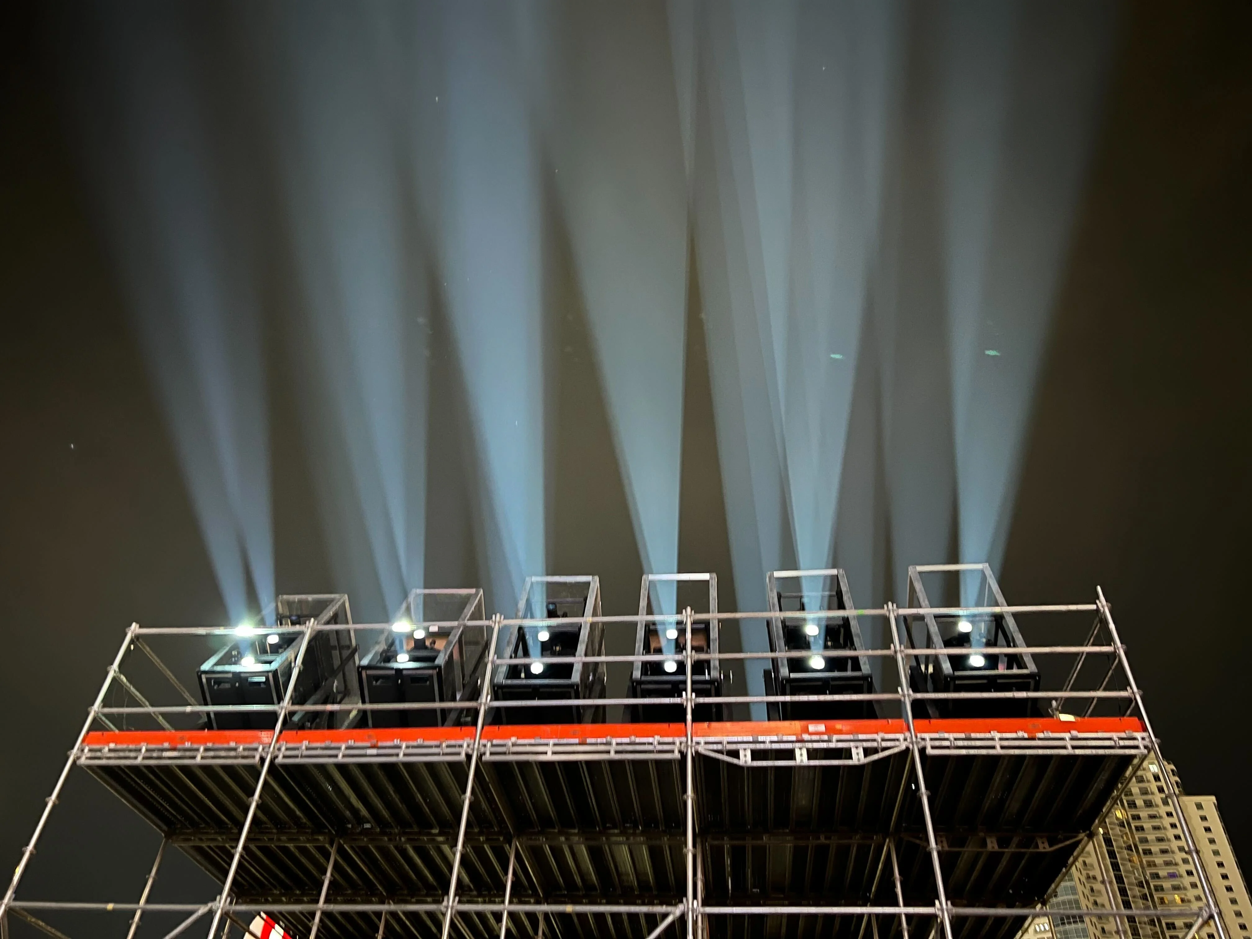 Music festival main stage illuminated by high-lumen projectors creating immersive visuals