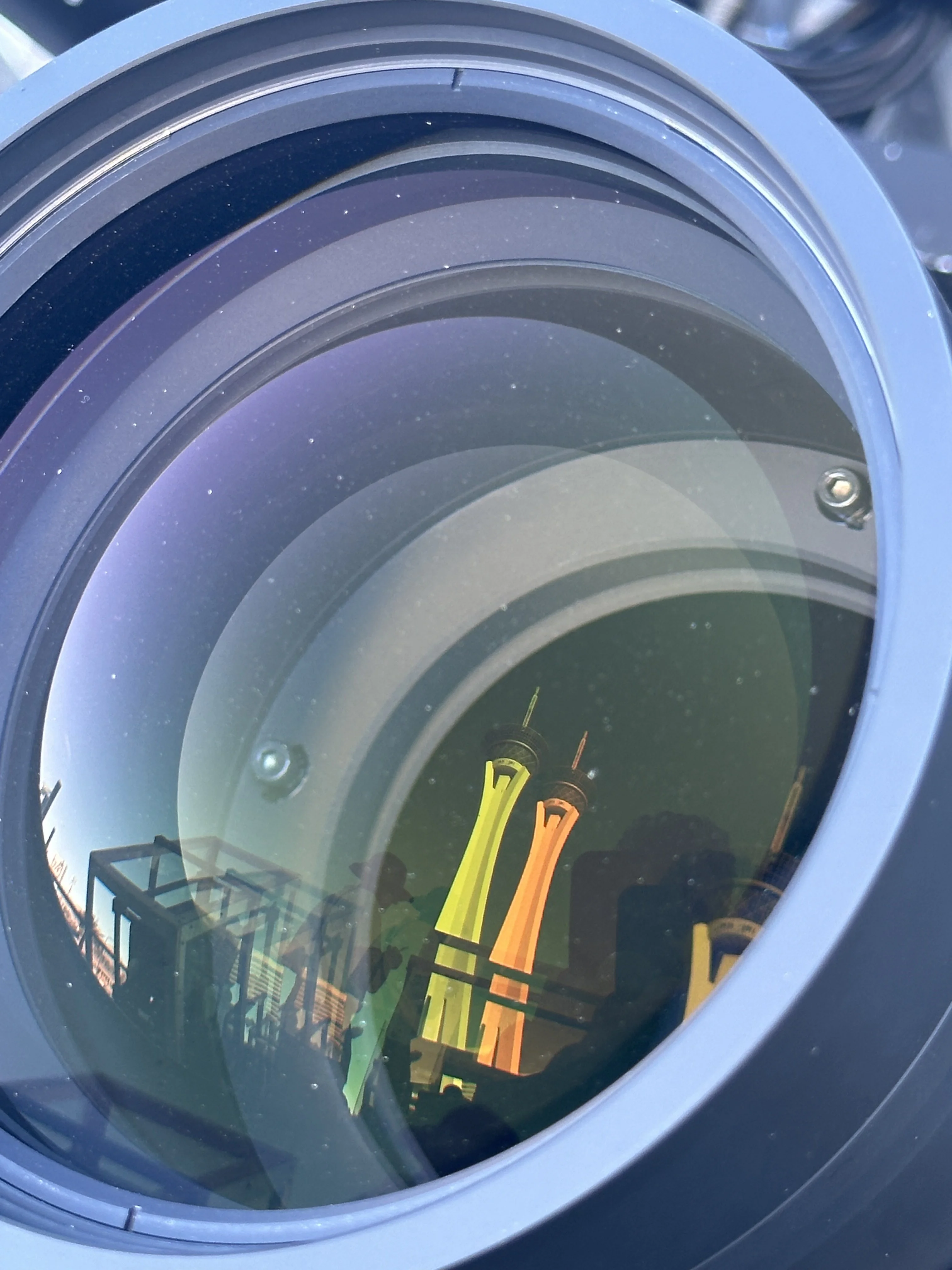 Close-up of a projector lens with concentric optics