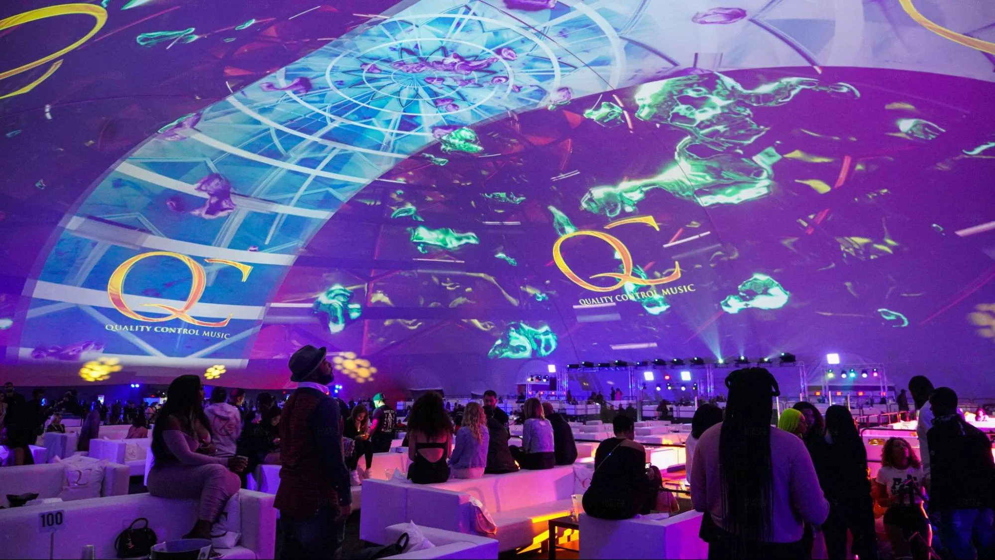 Dome projection system displaying immersive visuals inside a geodesic structure