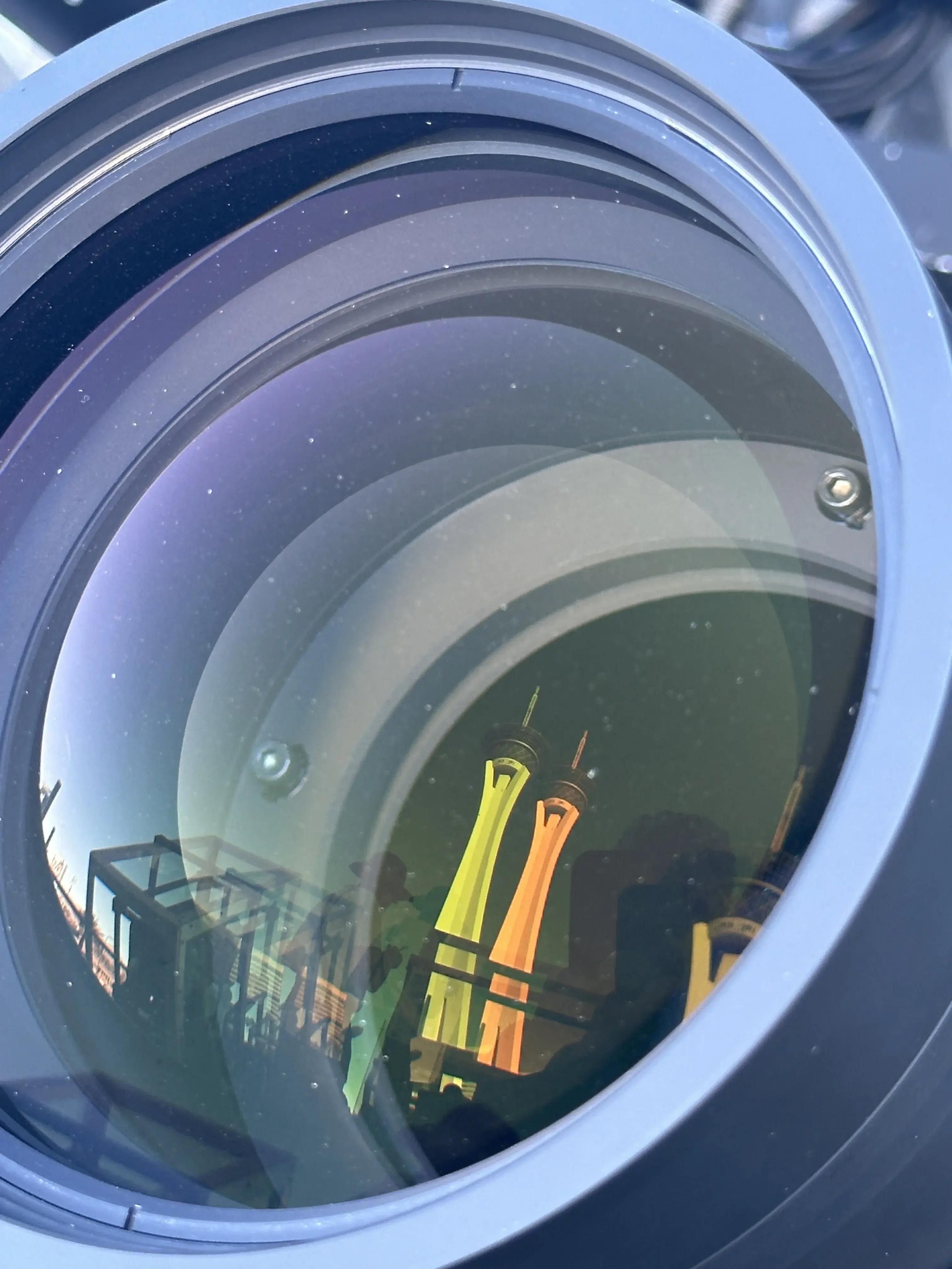 Close-up of a projector lens with concentric optics