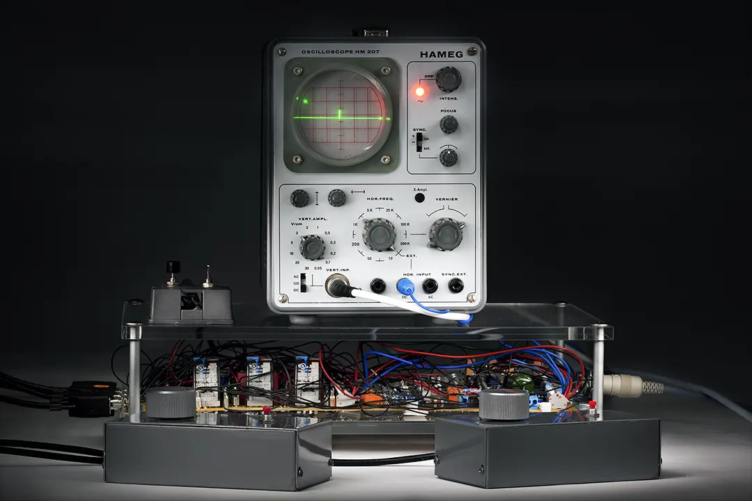 Recreation of Tennis for Two, the first video game from 1958, on a vintage Hameg oscilloscope wired to a circuit board