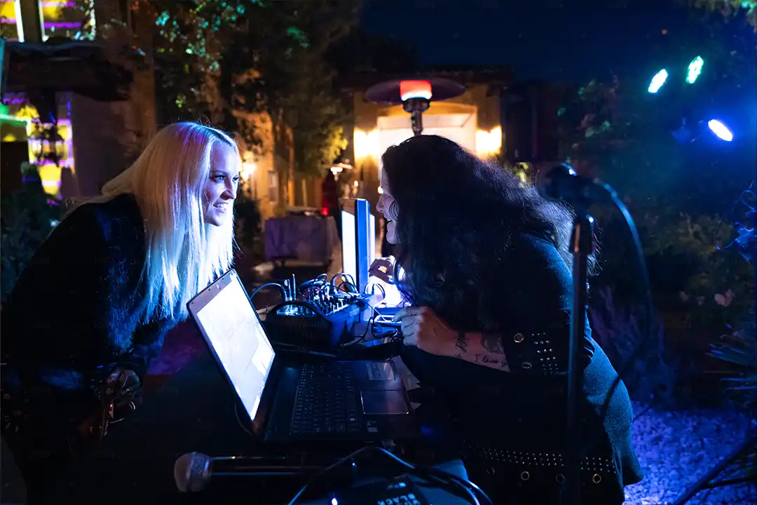 Marine Ball Two Women Conversing Over Tech
