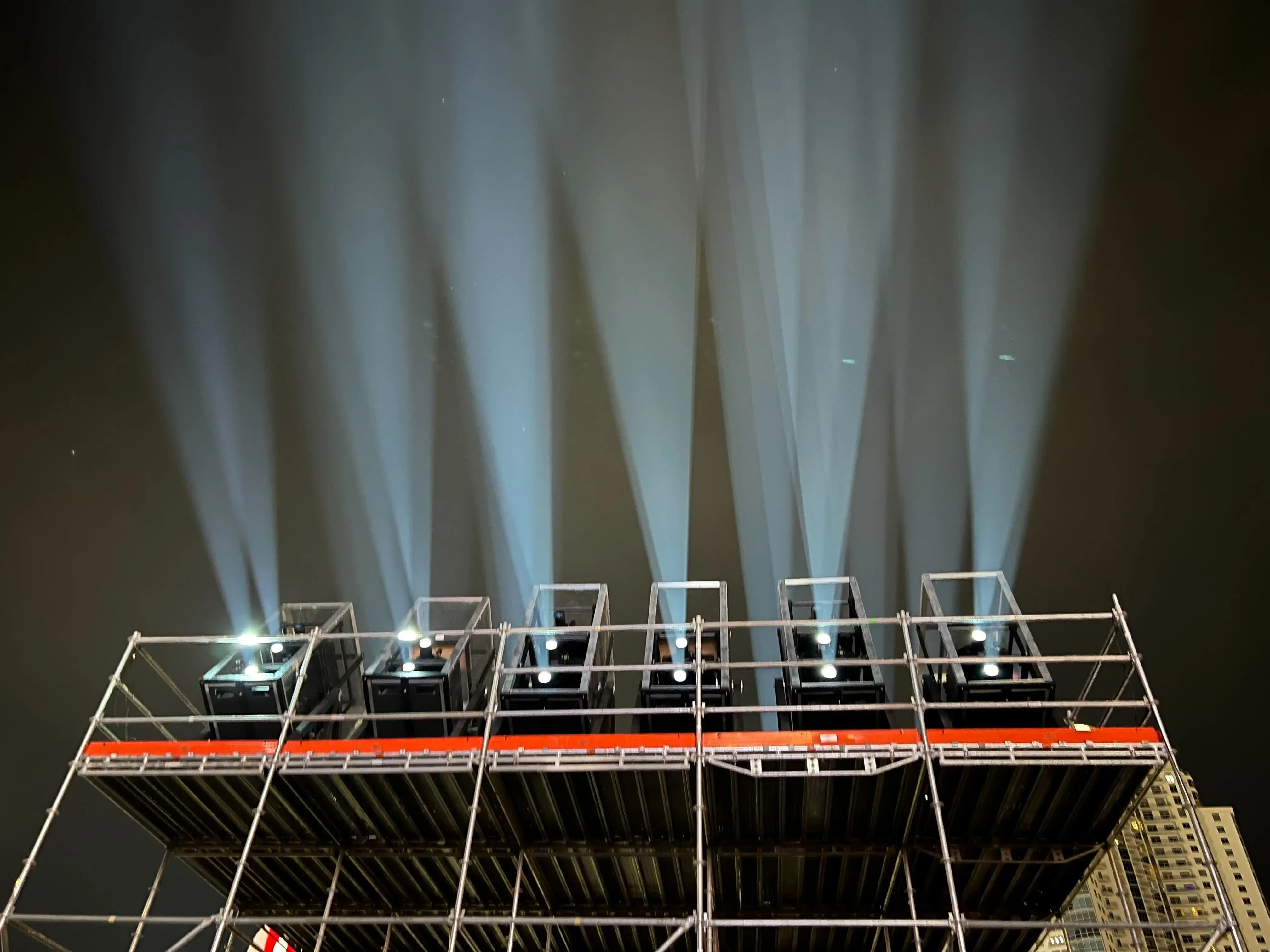 Music festival main stage illuminated by high-lumen projectors creating immersive visuals
