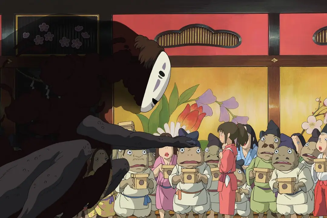 Scene from Spirited Away of a masked spirit reaching toward frog-faced bathhouse workers holding boxes