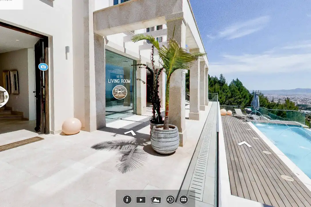 360 virtual tour of a villa terrace with pool and palm tree, showing a Go to Living Room hotspot and nav icons