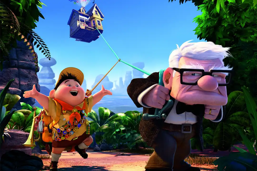 Scene from Up with Carl towing his balloon-lifted house through the jungle as a cheering young scout follows