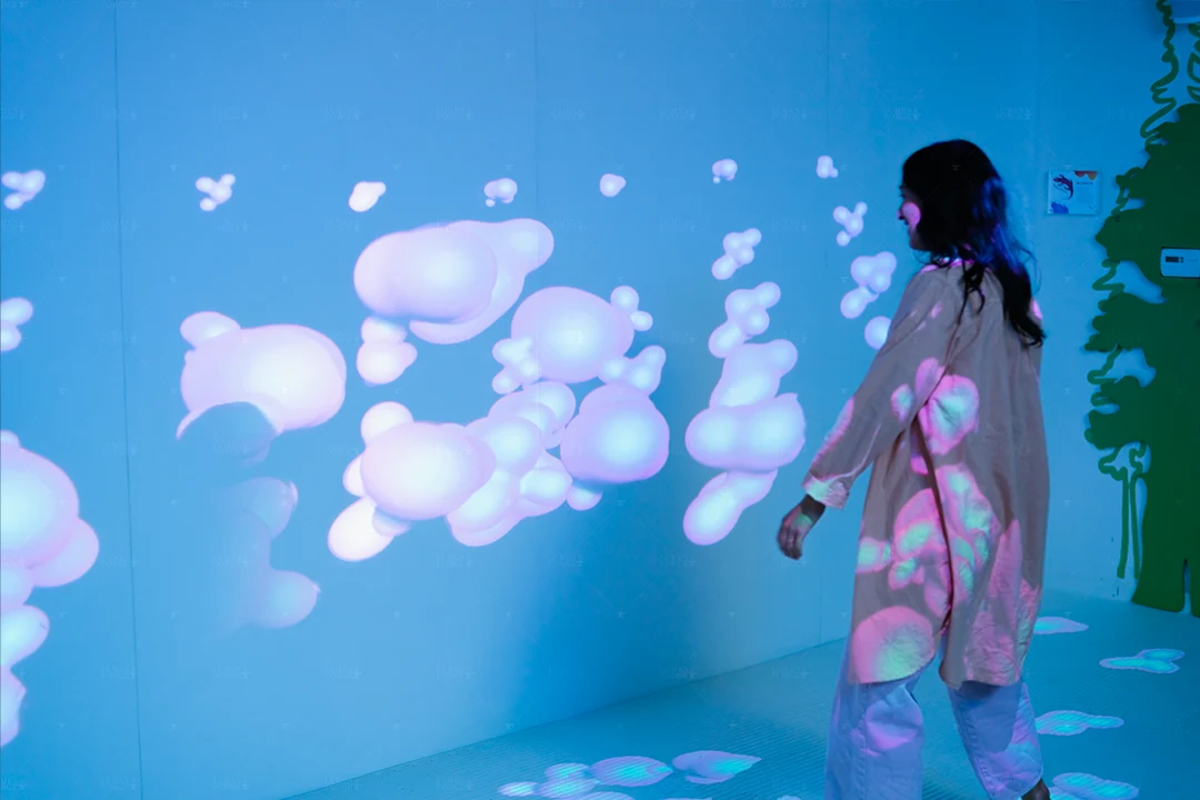 Wild Child Guest Playing With Interactive Bubble Wall
