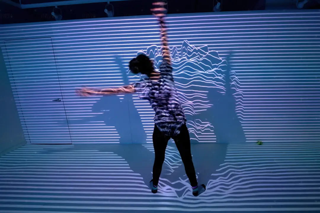 Wild Child Guest Playing With Interactive Lines Wall