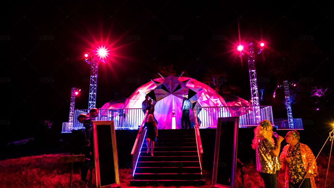 Big Sur immersive event dome lit by pink and purple LEDs