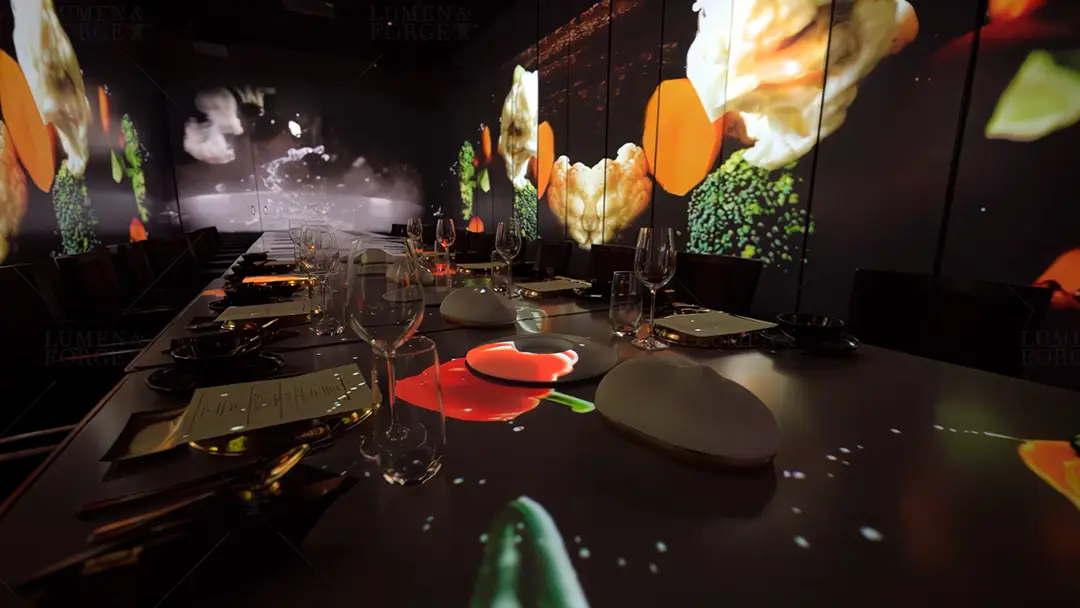 Immersive dining experience at X Pot in Las Vegas with projection mapping showcasing vibrant food visuals across tables and walls, creating a unique multi-sensory atmosphere for guests.