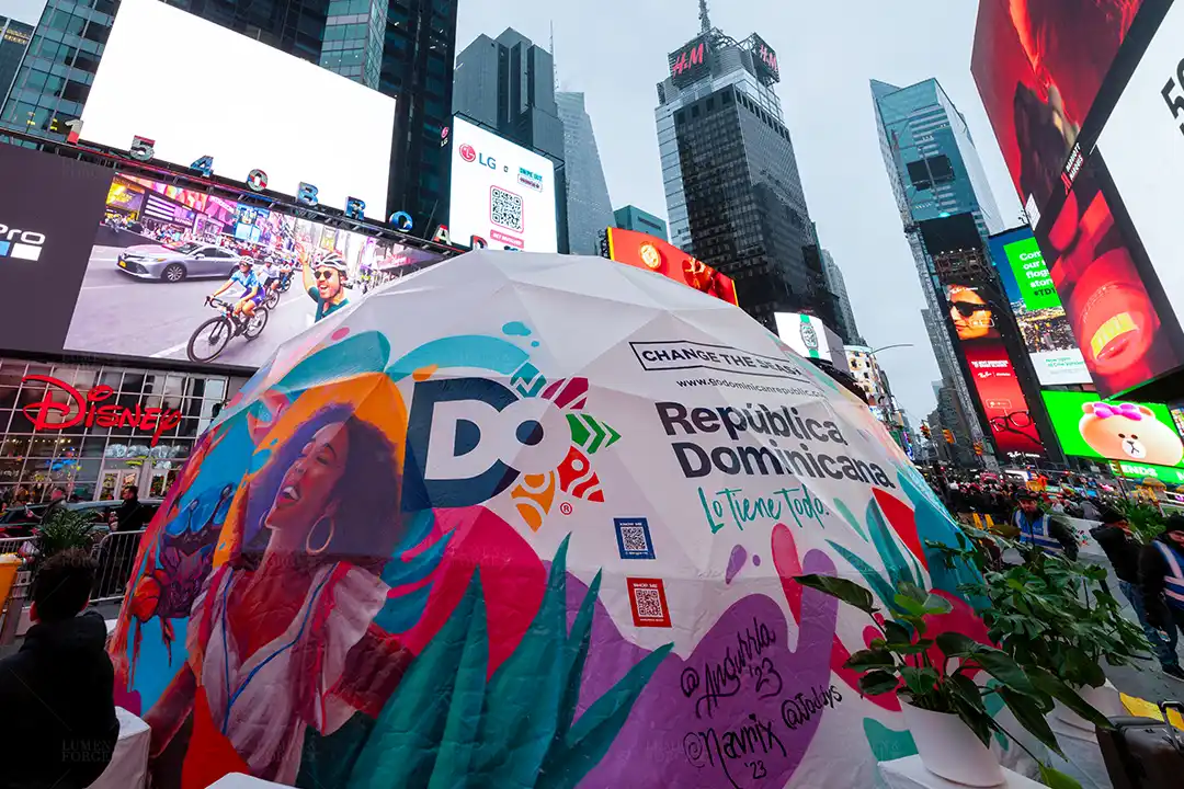 Pop-up dome for the Dominican Republic tourism promotion in Times Square, New York City, featuring vibrant hand-painted artwork, showcasing the nation's culture and attracting visitors.