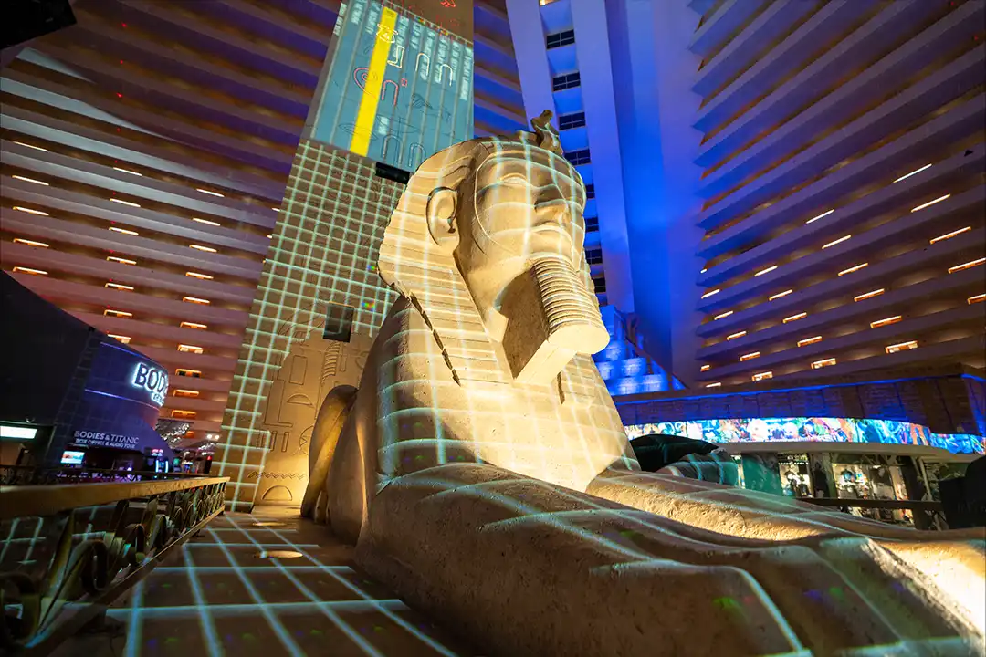 3D projection mapping on the Luxor Sphinx in Las Vegas, featuring digital grid overlays and dynamic lighting effects as part of an experiential marketing campaign inside the Luxor Hotel & Casino.